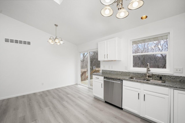 kitchen featuring pendant lighting, sink, white cabinets, a chandelier, and stainless steel dishwasher