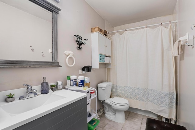 bathroom featuring tile patterned floors, toilet, curtained shower, and vanity