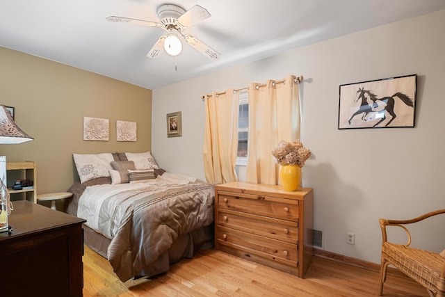 bedroom featuring ceiling fan and light hardwood / wood-style flooring