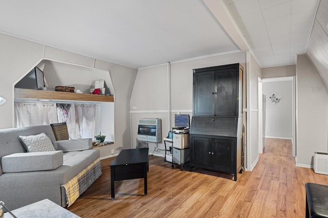 living room featuring heating unit and light wood-type flooring