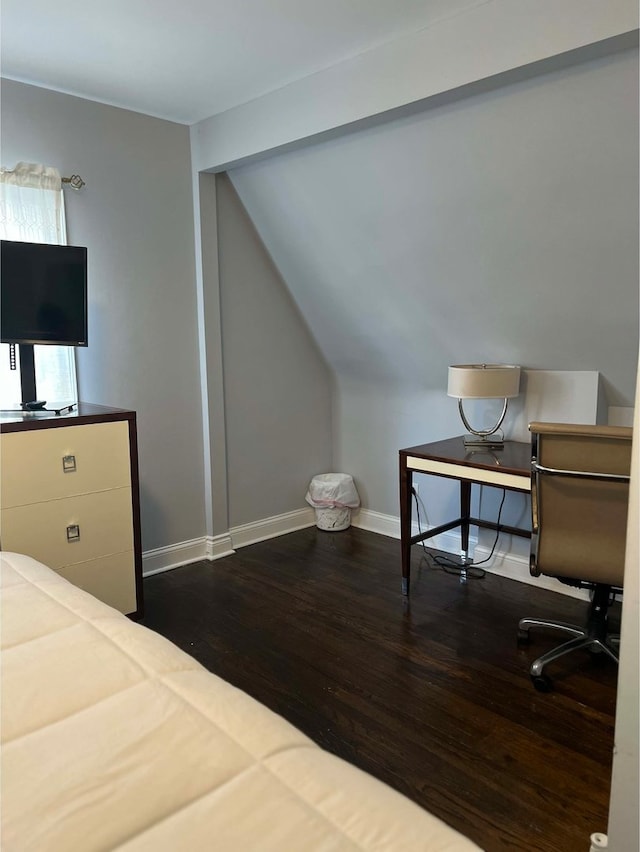 bedroom with lofted ceiling and wood-type flooring