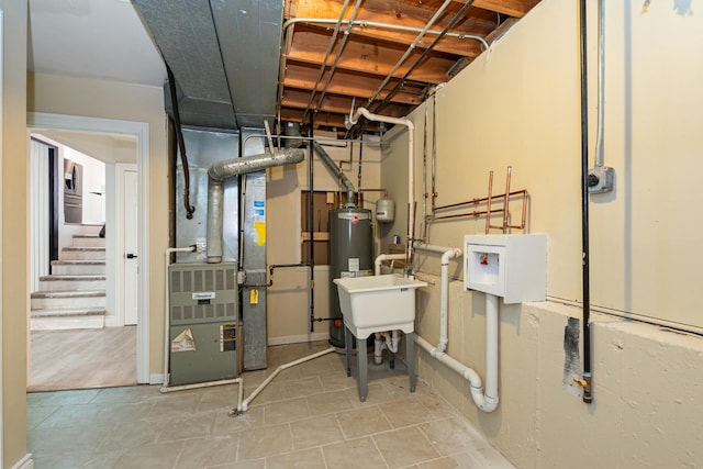 utility room featuring water heater and heating unit