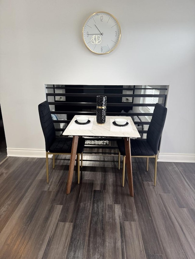 dining area with dark wood-type flooring