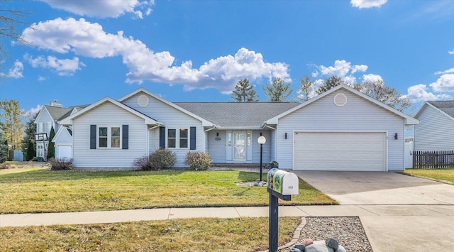 ranch-style home featuring a garage and a front lawn