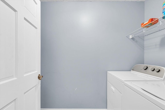 laundry room featuring washing machine and dryer