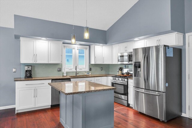 kitchen featuring white cabinetry, sink, stainless steel appliances, and stone countertops