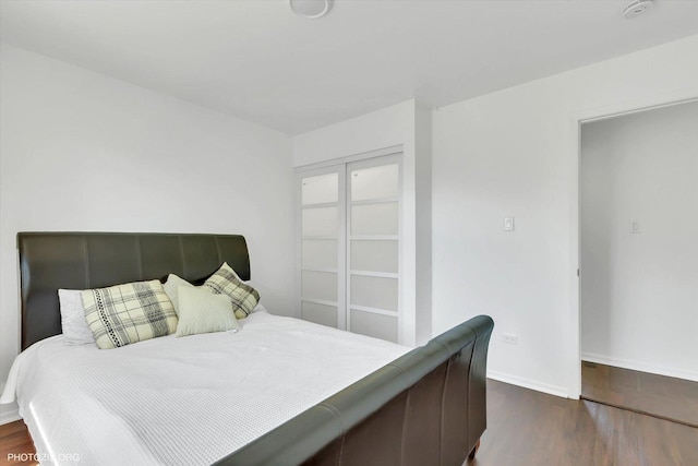 bedroom featuring dark hardwood / wood-style floors