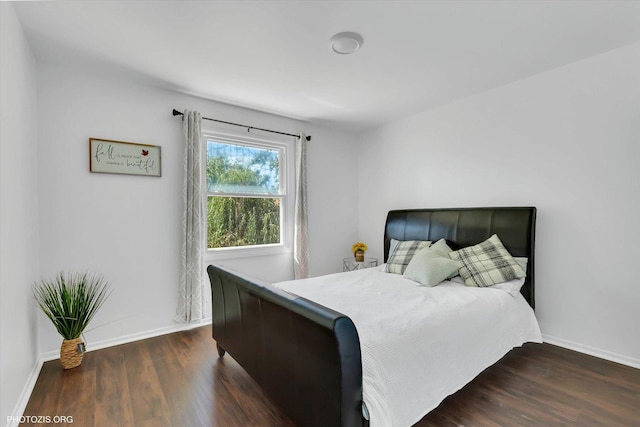 bedroom featuring dark hardwood / wood-style flooring