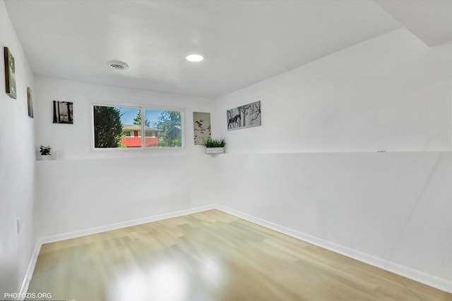 spare room featuring hardwood / wood-style floors