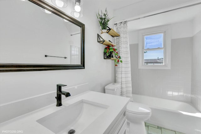 full bathroom featuring shower / bath combo, vanity, and toilet