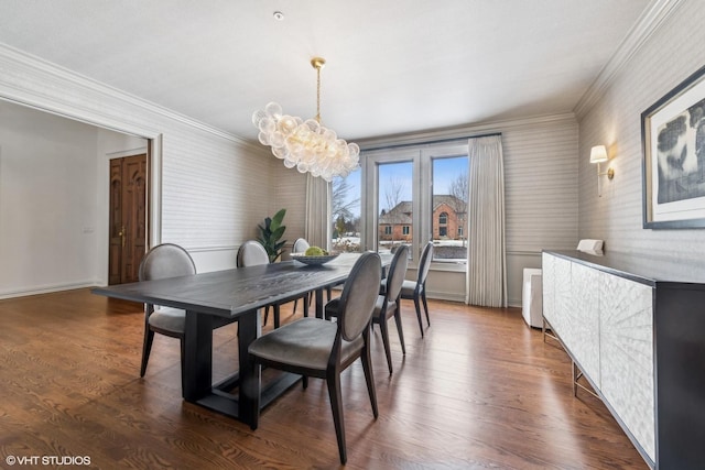 dining space featuring an inviting chandelier, dark wood-type flooring, and ornamental molding