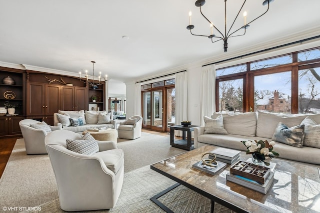 living room featuring ornamental molding and a chandelier