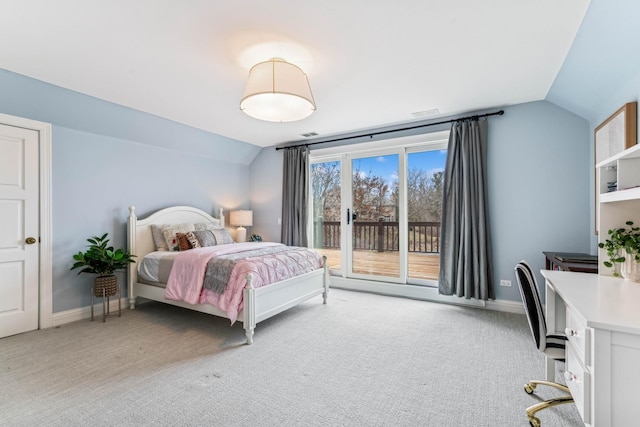 bedroom with lofted ceiling, light carpet, and access to outside