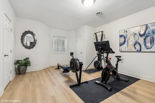 workout area featuring light hardwood / wood-style flooring