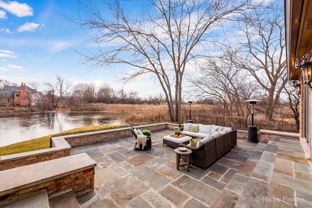 view of patio / terrace featuring a water view and outdoor lounge area