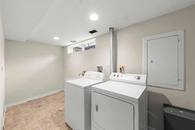 laundry room featuring laundry area, baseboards, visible vents, washer and dryer, and recessed lighting