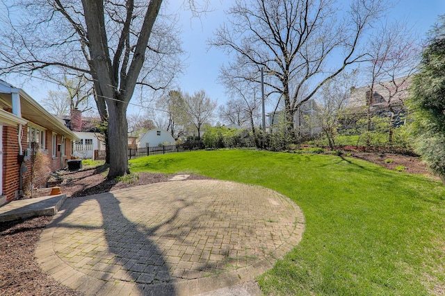 view of yard featuring a patio and fence