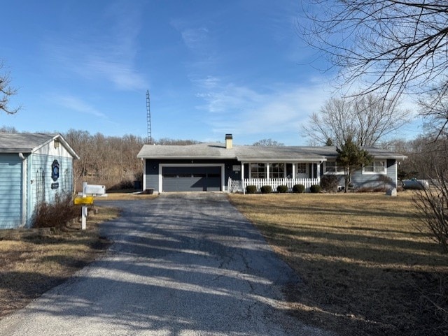 view of front of property with a garage and covered porch