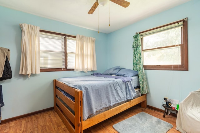 bedroom featuring ceiling fan and hardwood / wood-style floors