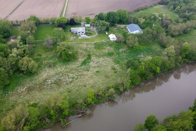 birds eye view of property featuring a water view and a rural view