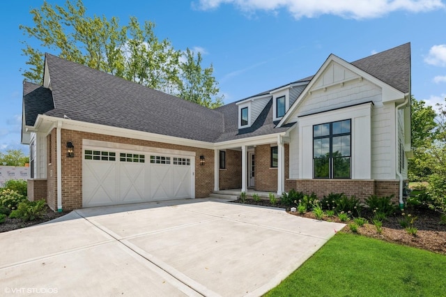 view of front of property featuring a garage, a front yard, and a porch