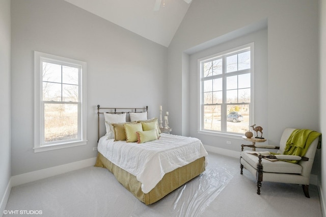 bedroom with lofted ceiling and carpet floors