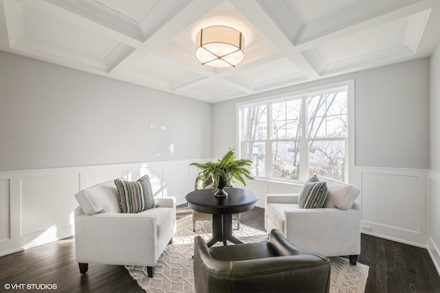 living area featuring coffered ceiling, beam ceiling, and dark hardwood / wood-style floors