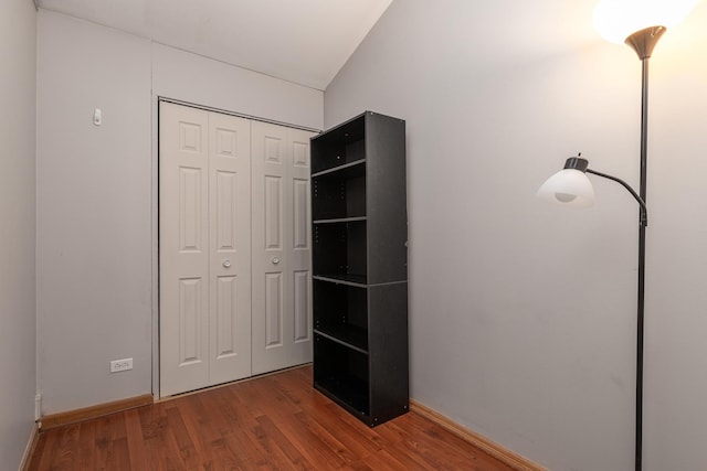 unfurnished bedroom with a closet and wood finished floors