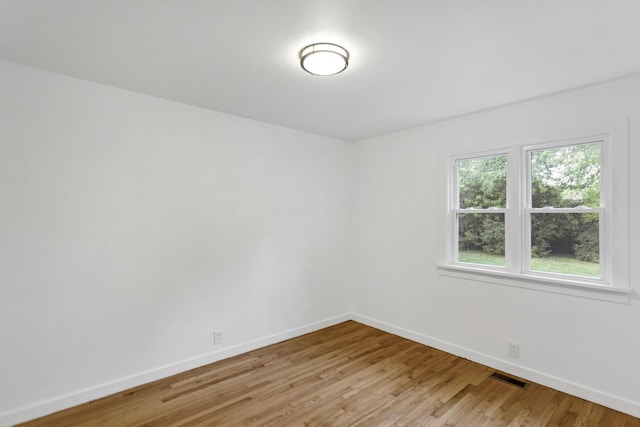 unfurnished room featuring light wood-type flooring