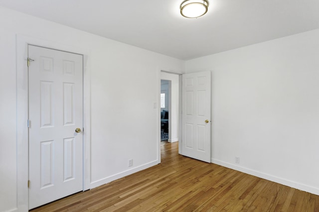 spare room featuring light hardwood / wood-style floors