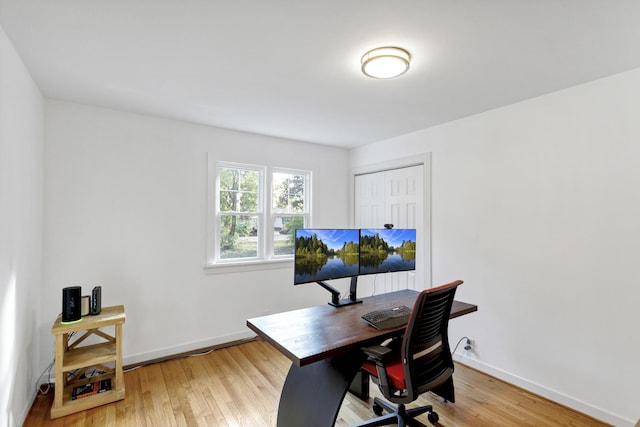 office space with hardwood / wood-style flooring