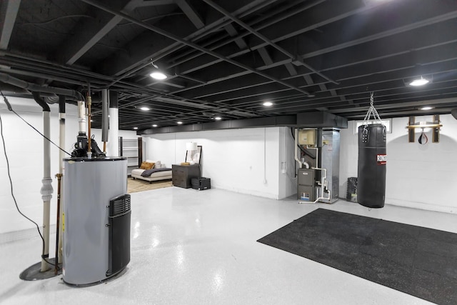 basement featuring heating unit and water heater