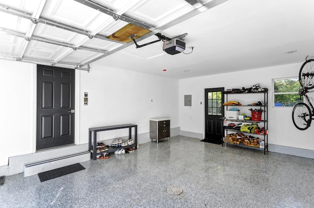 garage featuring a garage door opener and electric panel