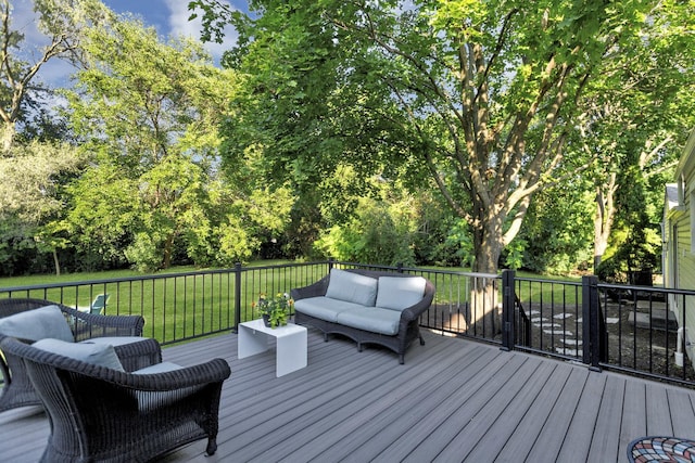 wooden terrace with an outdoor hangout area and a lawn