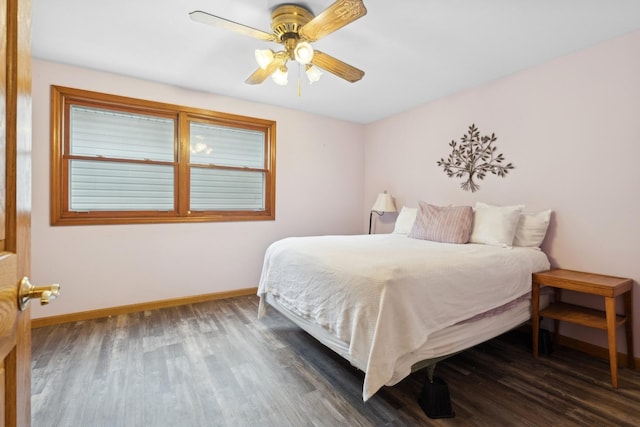 bedroom with dark wood-type flooring and ceiling fan