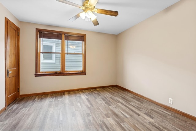 spare room featuring ceiling fan and light hardwood / wood-style floors