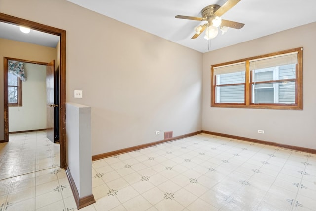 unfurnished room with ceiling fan