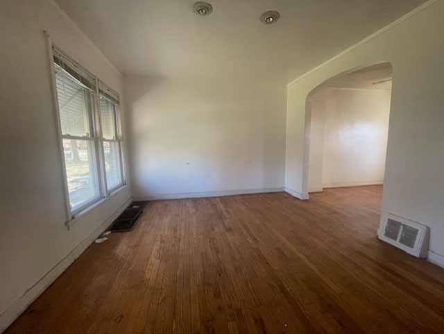 unfurnished room with dark hardwood / wood-style flooring