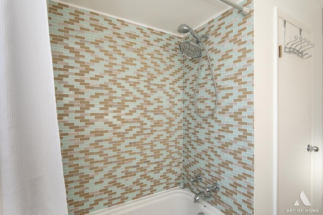 bathroom with shower / bath combination with curtain