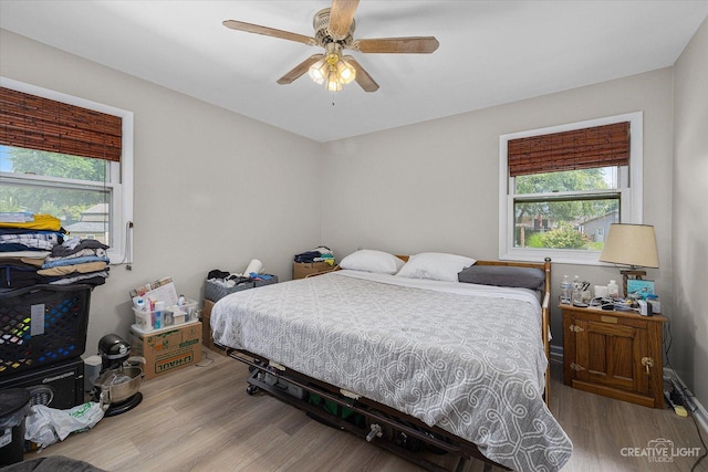 bedroom featuring ceiling fan and light wood-type flooring