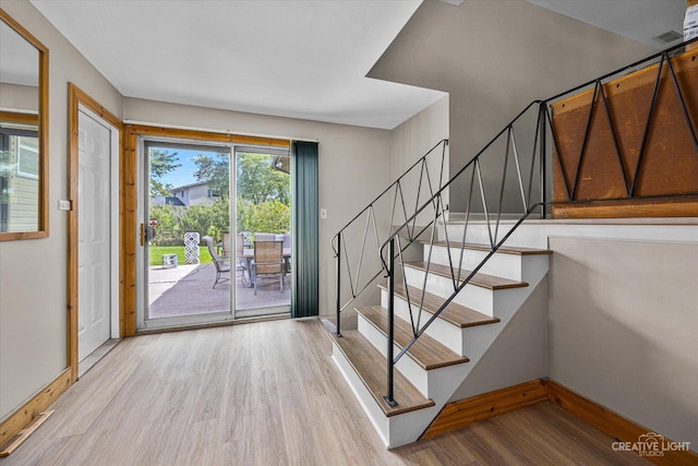 foyer entrance with light hardwood / wood-style flooring