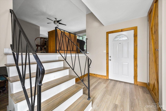 foyer featuring ceiling fan and light wood-type flooring