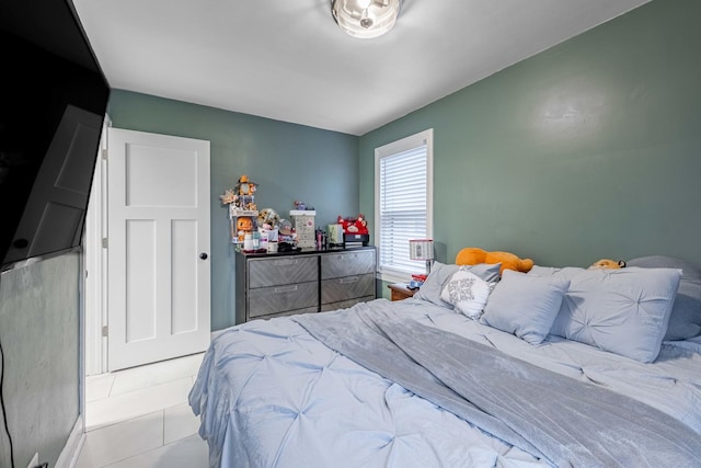 bedroom with light tile patterned floors