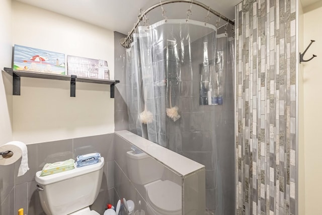 bathroom with a shower with curtain and toilet