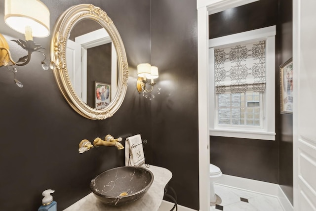 bathroom featuring toilet and sink