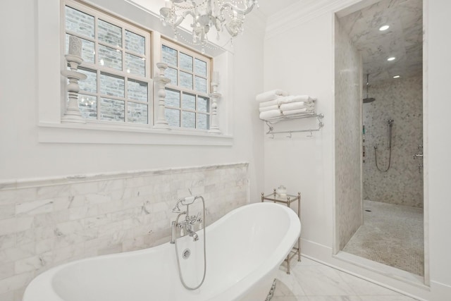 bathroom with ornamental molding, a chandelier, and plus walk in shower