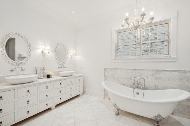 bathroom featuring a washtub, vanity, crown molding, and tile walls