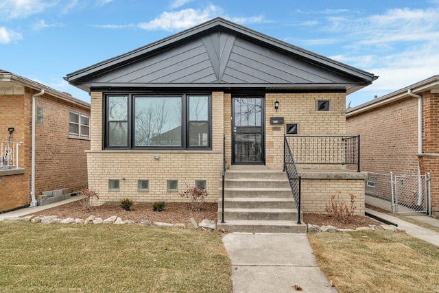 bungalow with a front lawn