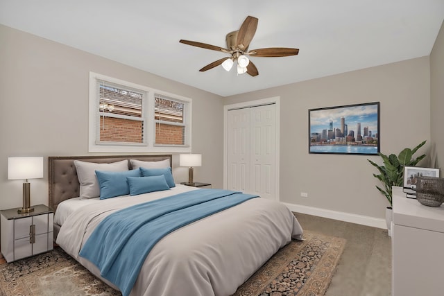 carpeted bedroom featuring ceiling fan and a closet