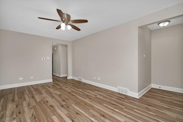 unfurnished room with light hardwood / wood-style flooring and ceiling fan